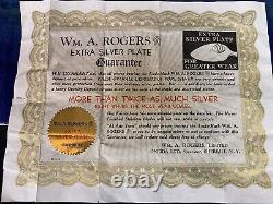 Ensemble de 52 pièces Wm A Rogers Oneida Ltd 1938 avec certificat de garantie de plaquage argent supplémentaire